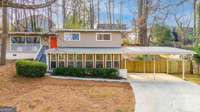 front facade featuring a carport and a sunroom