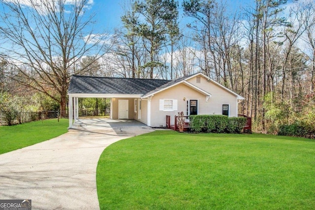 single story home featuring a carport and a front yard