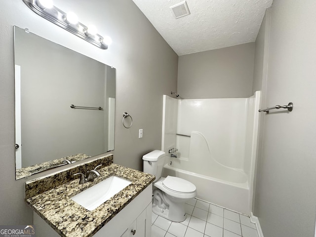 full bathroom featuring tile patterned flooring, tub / shower combination, a textured ceiling, toilet, and vanity