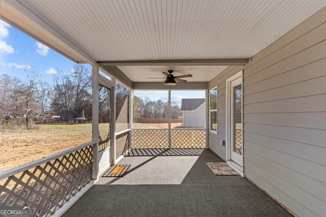 view of patio with a trampoline and ceiling fan