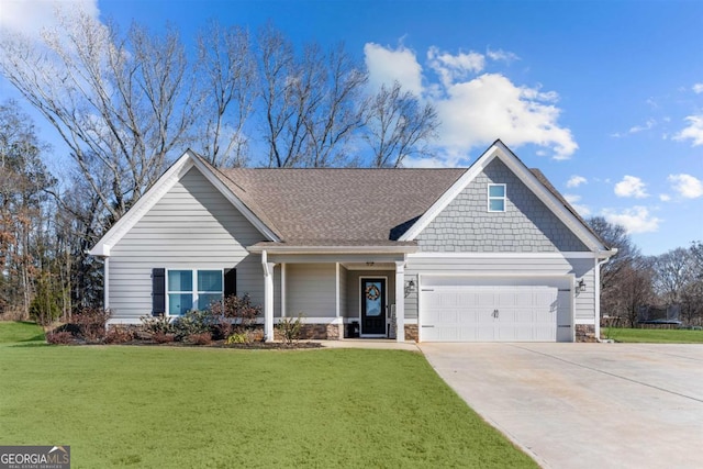 view of front of home featuring a garage and a front yard