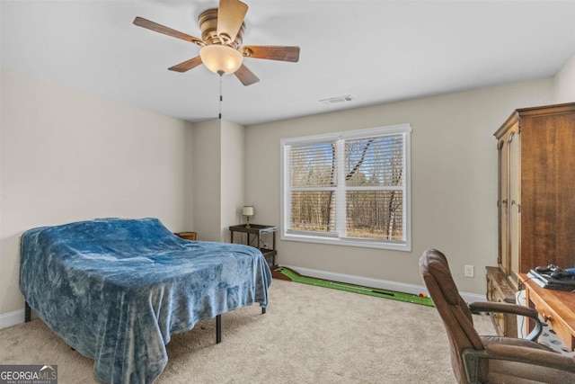 bedroom with ceiling fan and light carpet