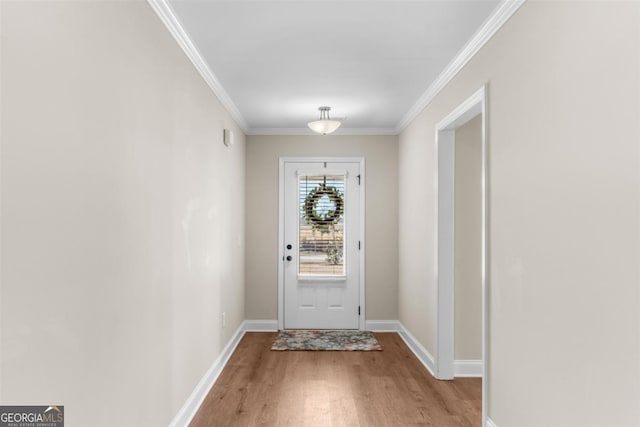 doorway with wood-type flooring and crown molding