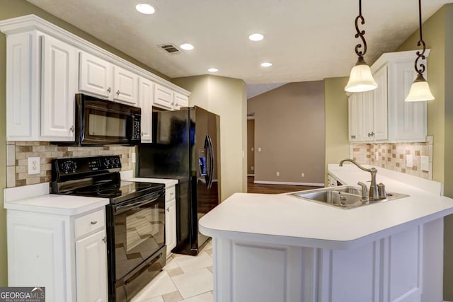 kitchen with black appliances, decorative light fixtures, white cabinetry, and sink