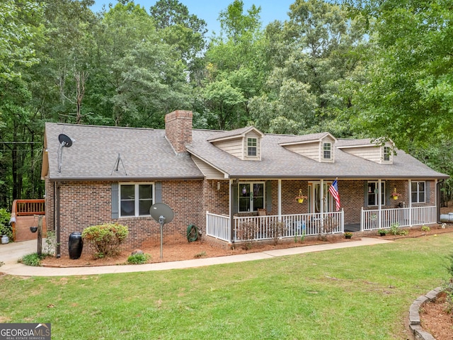 view of front of home featuring covered porch and a front lawn