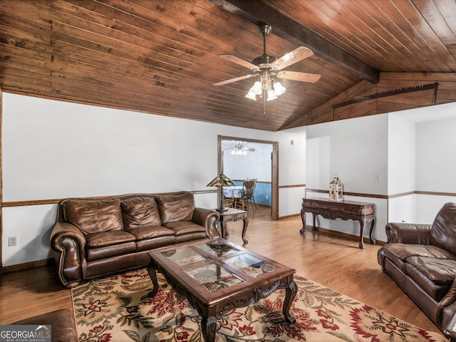 living room featuring vaulted ceiling with beams, ceiling fan, wooden ceiling, and light wood-type flooring