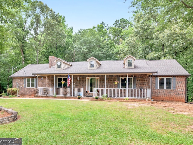 cape cod-style house with a porch and a front yard