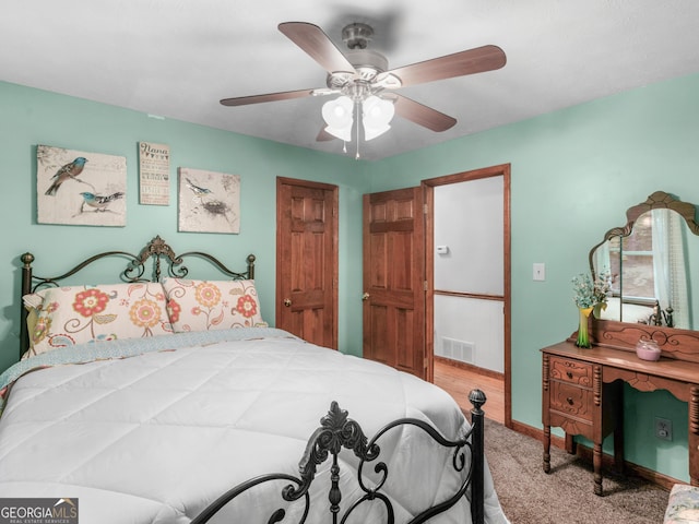 bedroom featuring ceiling fan and carpet floors