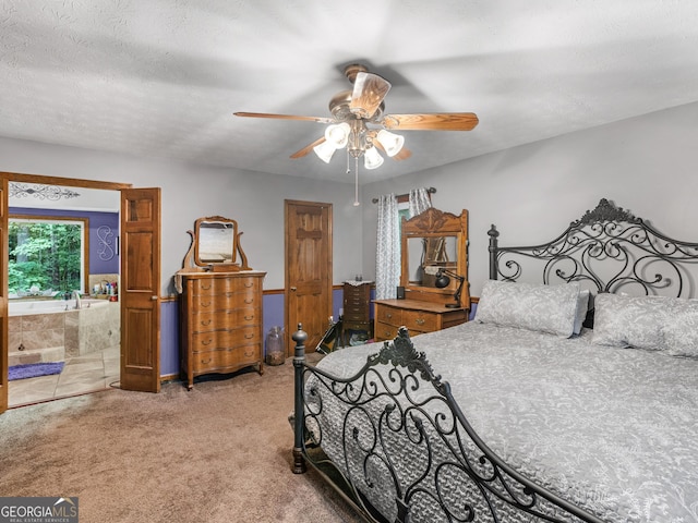 carpeted bedroom featuring ensuite bath, ceiling fan, and a textured ceiling