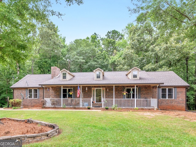 view of front of home with a front yard and a porch