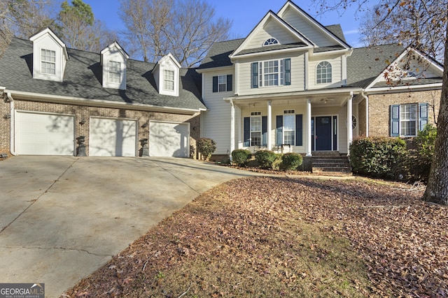 view of front of property featuring a garage and covered porch