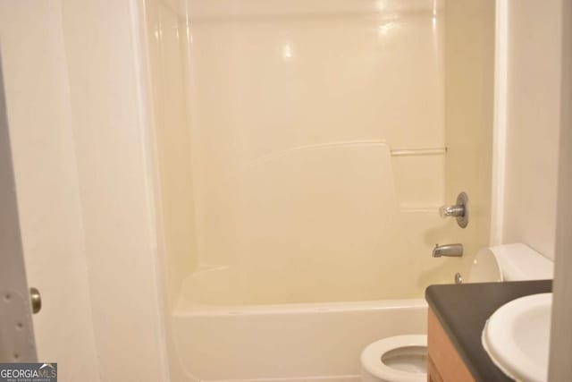 full bathroom featuring vanity, shower / bath combination, and toilet