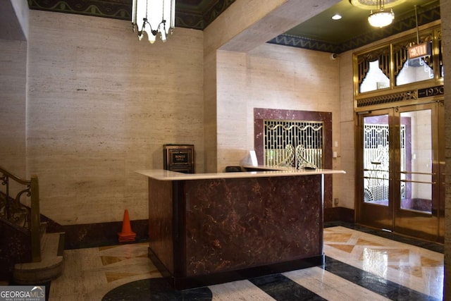 reception with an inviting chandelier and french doors