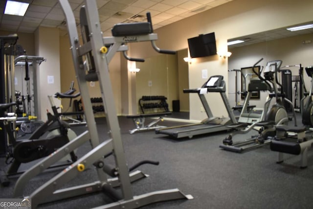 workout area featuring a drop ceiling