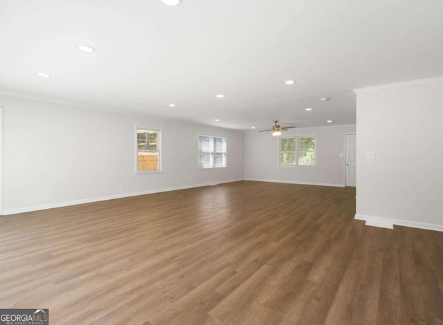 empty room featuring ceiling fan, ornamental molding, and hardwood / wood-style flooring