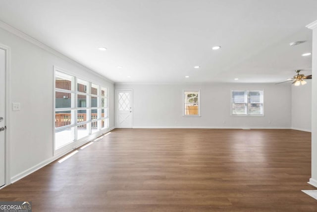 unfurnished room with crown molding, ceiling fan, and dark hardwood / wood-style floors