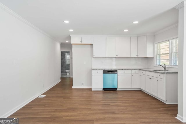 kitchen with decorative backsplash, light stone counters, stainless steel dishwasher, sink, and white cabinetry