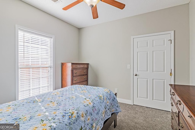 carpeted bedroom featuring ceiling fan