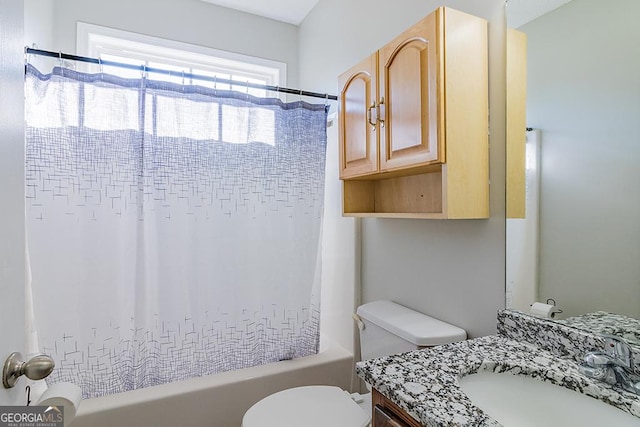 full bathroom featuring bathtub / shower combination, vanity, and toilet