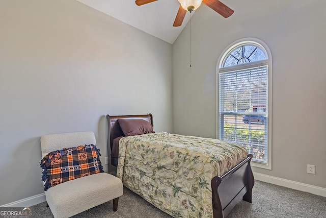 carpeted bedroom featuring ceiling fan and vaulted ceiling