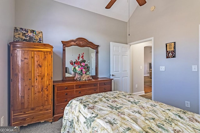 bedroom featuring ceiling fan, carpet, and lofted ceiling