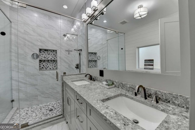 bathroom with vanity and an enclosed shower