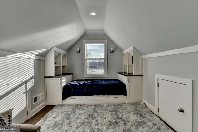 bedroom with vaulted ceiling