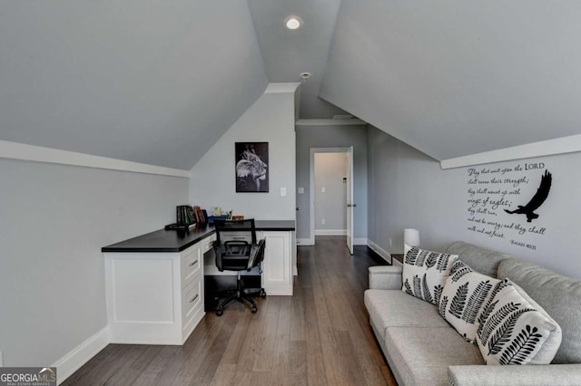 office area with dark hardwood / wood-style flooring, built in desk, and lofted ceiling