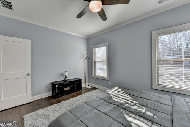 bedroom with ceiling fan, crown molding, and dark hardwood / wood-style floors