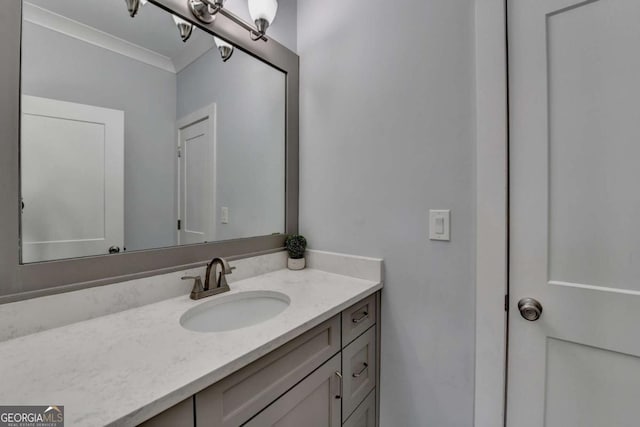 bathroom featuring vanity and crown molding