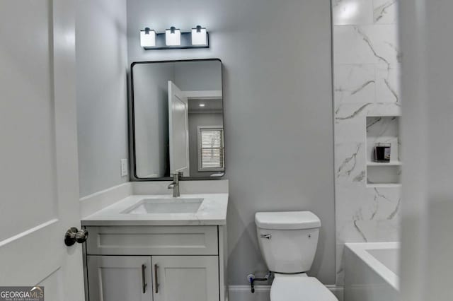 bathroom with vanity and toilet