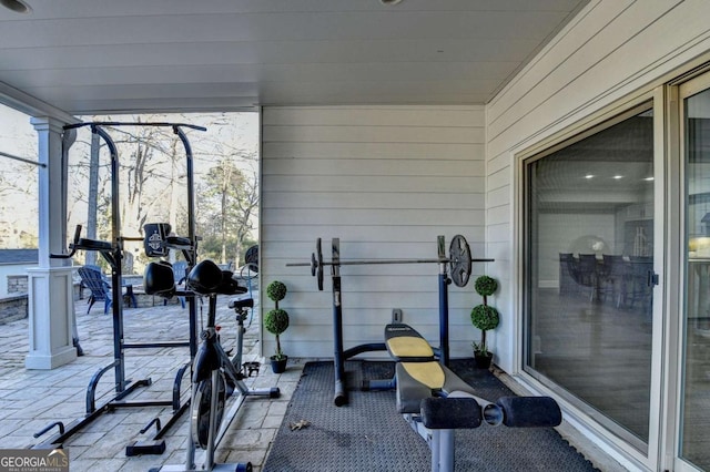 exercise area featuring wood walls