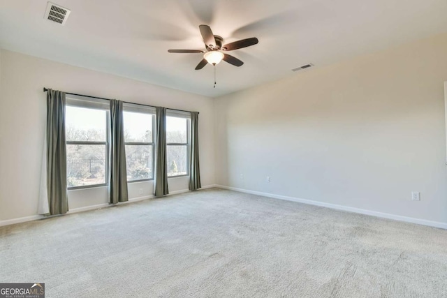 carpeted empty room with ceiling fan