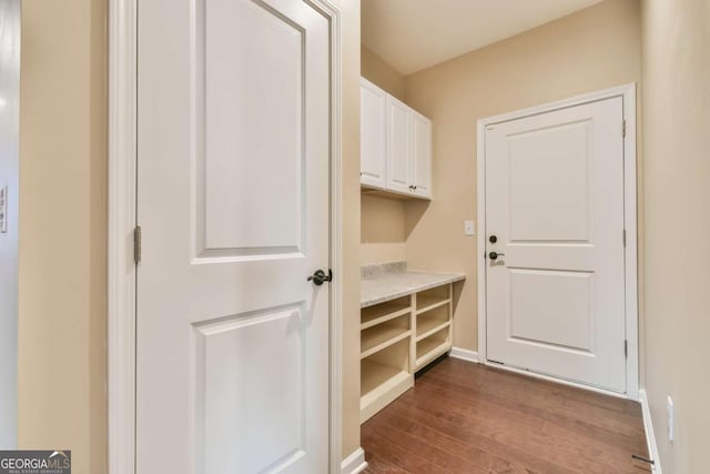 mudroom with dark hardwood / wood-style floors