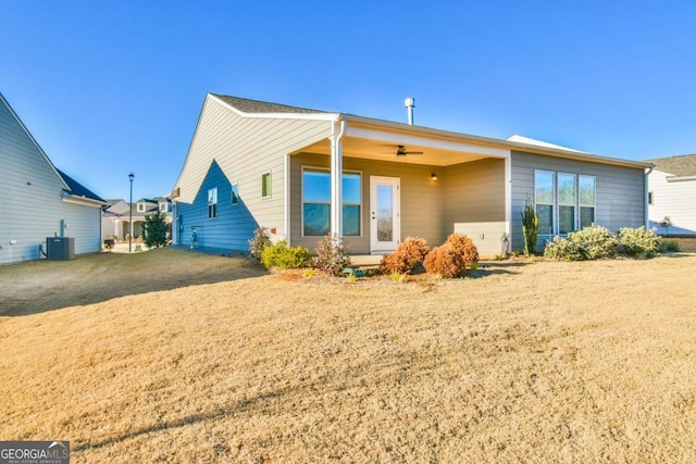 back of property featuring central AC unit and ceiling fan