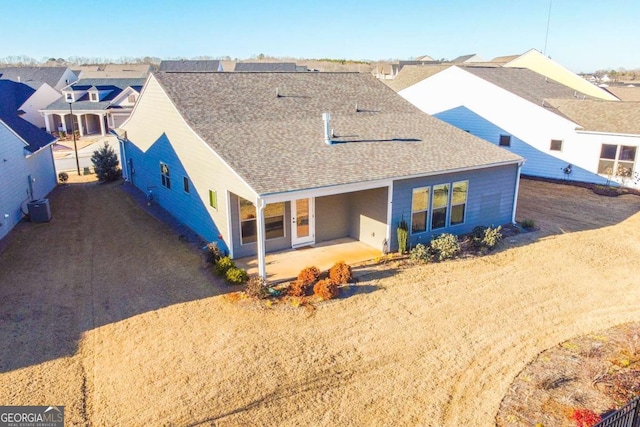 back of property featuring central AC and a patio area