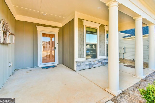 view of exterior entry featuring a porch