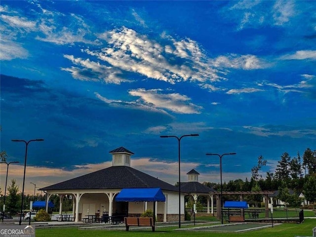 view of home's community with a yard