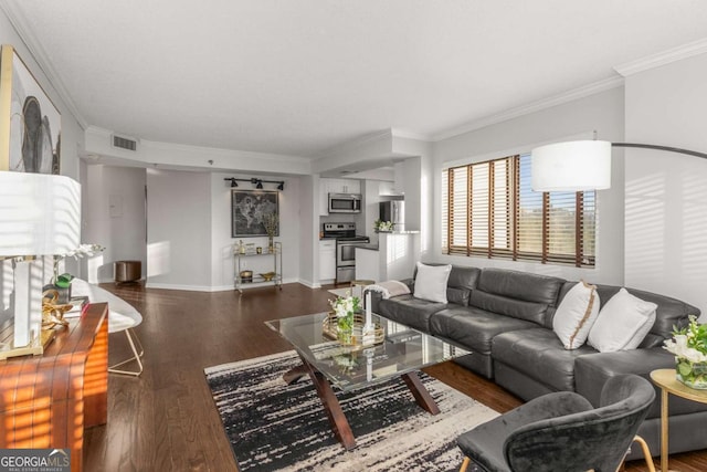 living room featuring ornamental molding and dark hardwood / wood-style flooring