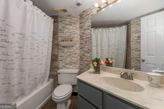 full bathroom featuring vanity, tile patterned flooring, shower / bath combination with curtain, and toilet