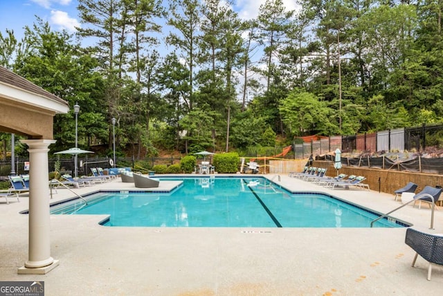 view of pool featuring a patio