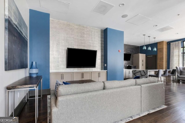 living room with dark hardwood / wood-style flooring