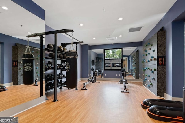 exercise area with hardwood / wood-style floors