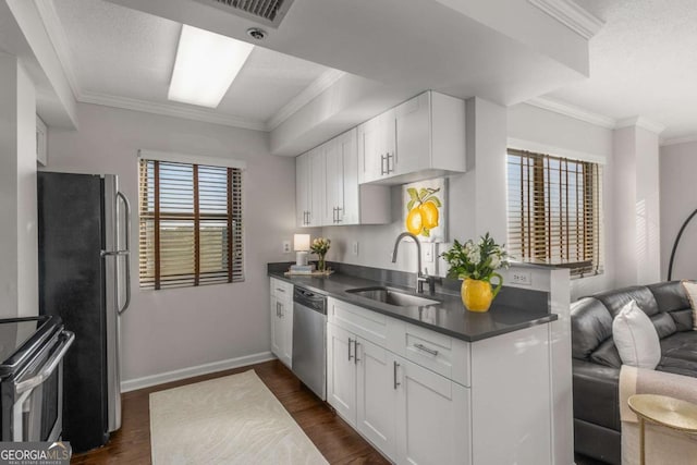 kitchen featuring sink, stainless steel appliances, dark hardwood / wood-style floors, and white cabinets