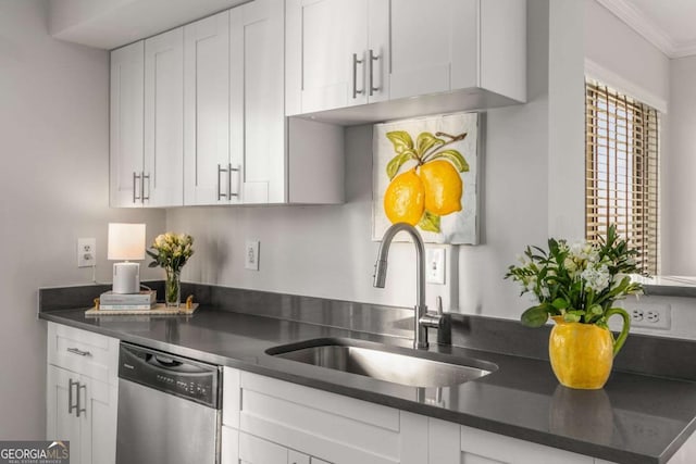 kitchen featuring white cabinetry, sink, ornamental molding, and stainless steel dishwasher