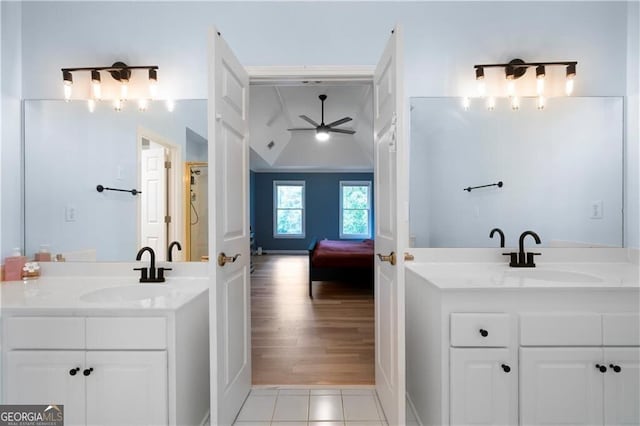 bathroom featuring tile patterned flooring, vanity, and ceiling fan