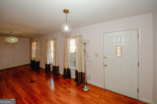 foyer entrance with dark hardwood / wood-style floors