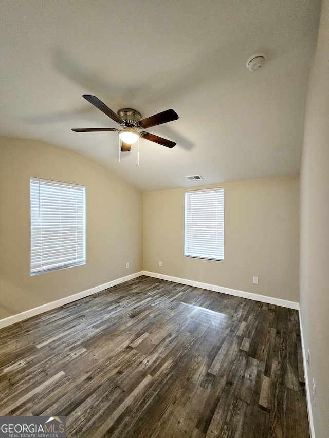 unfurnished room with dark wood-type flooring, lofted ceiling, and ceiling fan