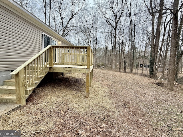 view of yard with a wooden deck