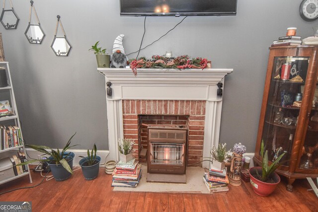 interior space featuring a fireplace and hardwood / wood-style flooring